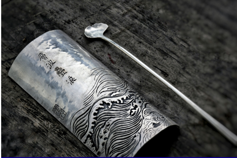 A custom-made tea holder and teaspoon