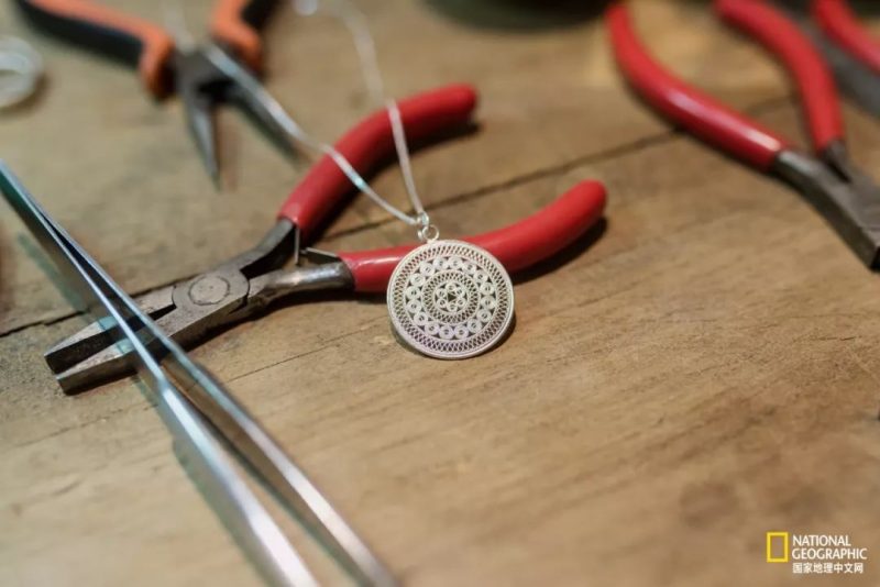 A finished traditional Miao silver pendant (auspicious drum)