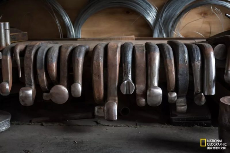 A potting tool is placed inside the pot for sculpting and shaping.