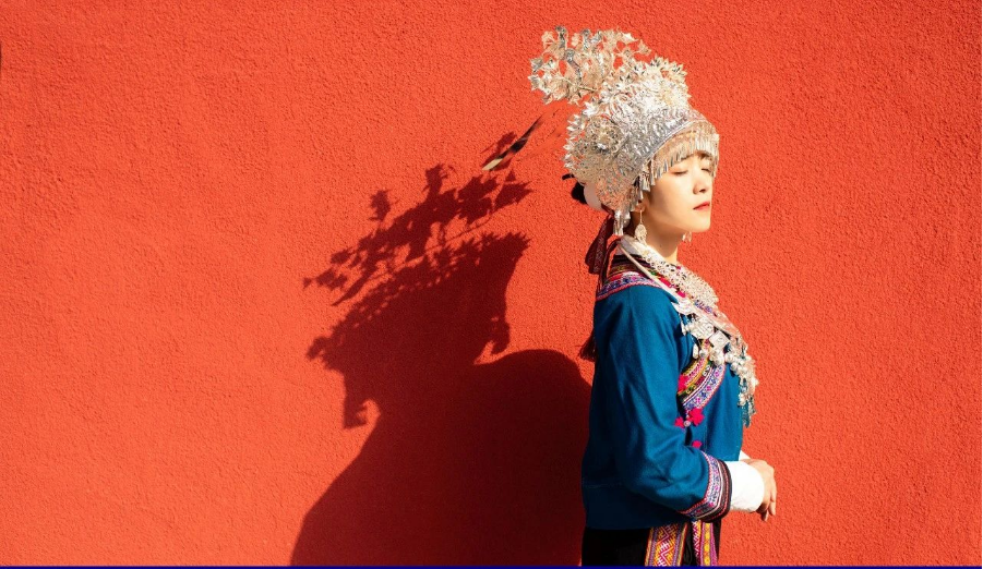 Aduo attired in traditional Miao holiday array