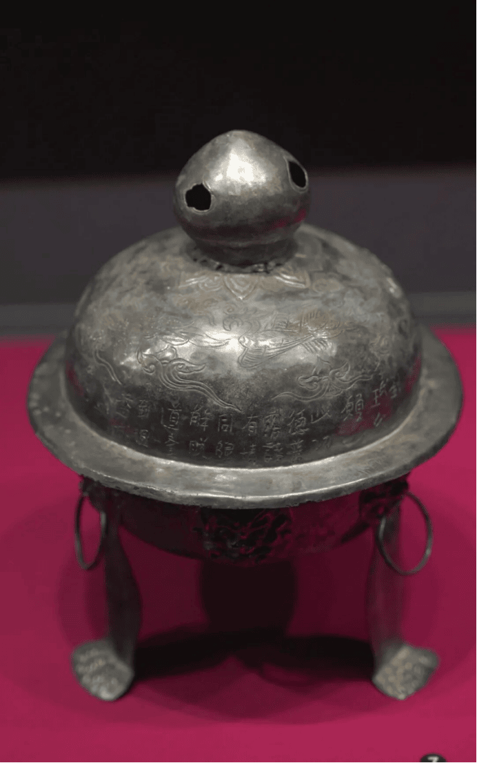 Ancient silver vessel with intricate design