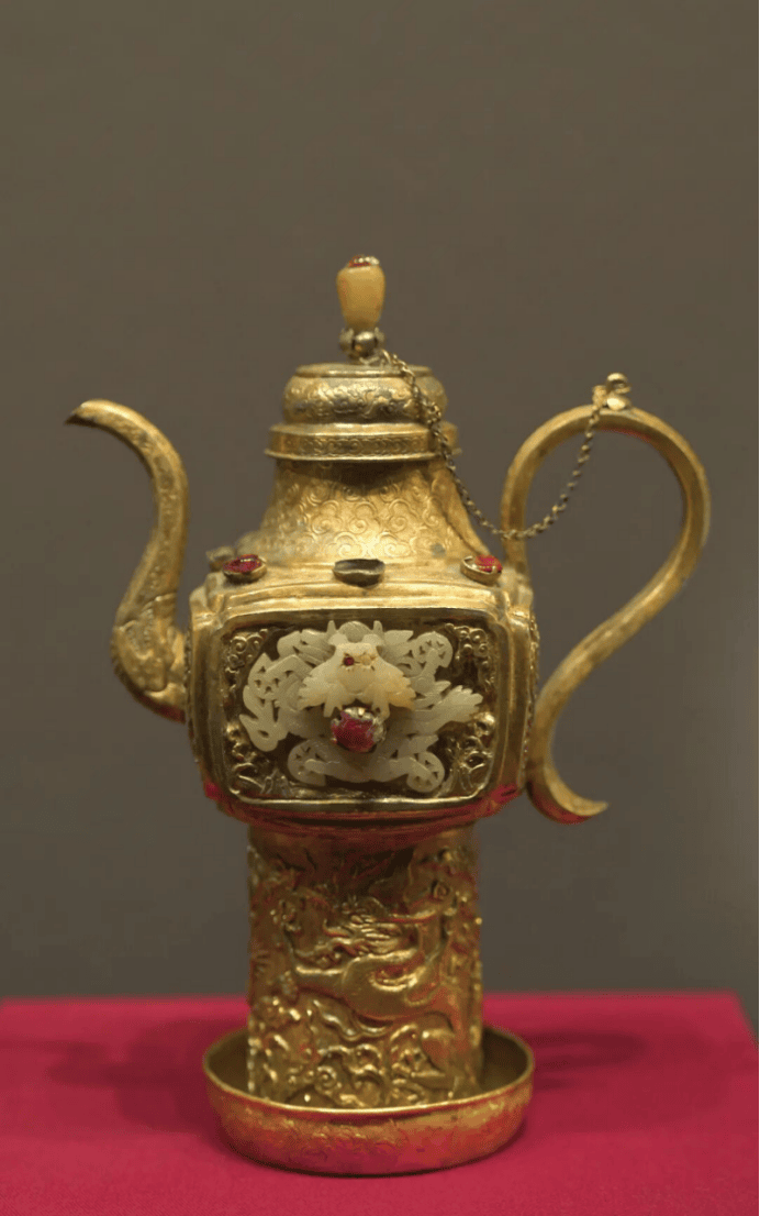 Ornate gold teapot with intricate design