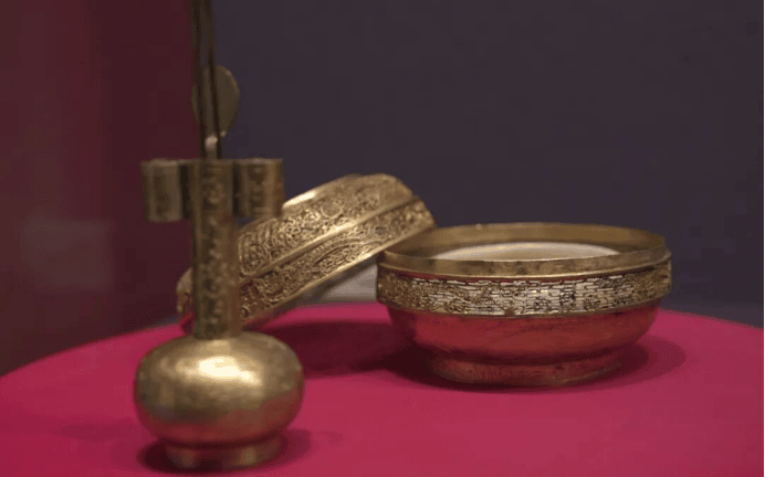 Intricate gold and silver artifacts displayed.