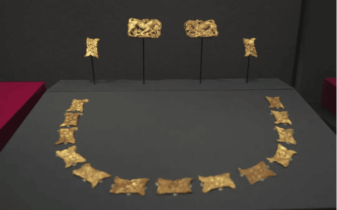 Ancient gold artifacts displayed artistically.
