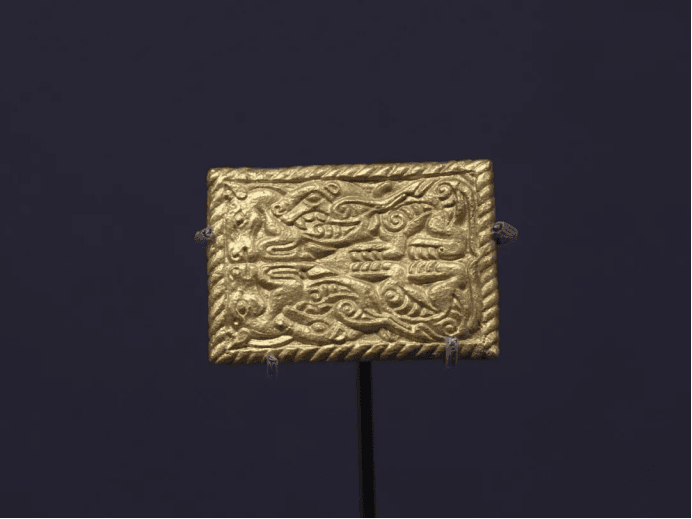 Intricate gold plaque with animal motifs