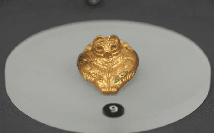 Golden artifact shaped like a bear