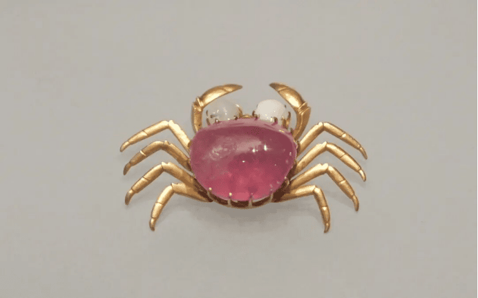 Golden crab brooch with gemstone body