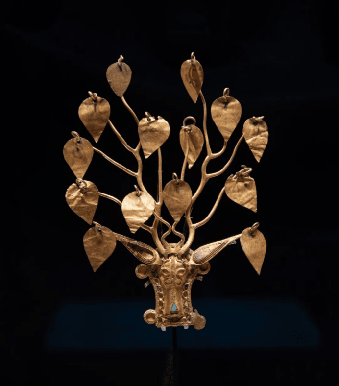 Intricate gold tree ornament design.