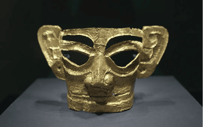 Ancient gold mask with intricate design.