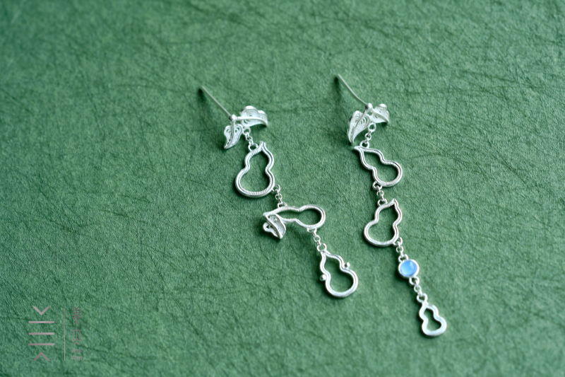 Elegant silver earrings with gourd design